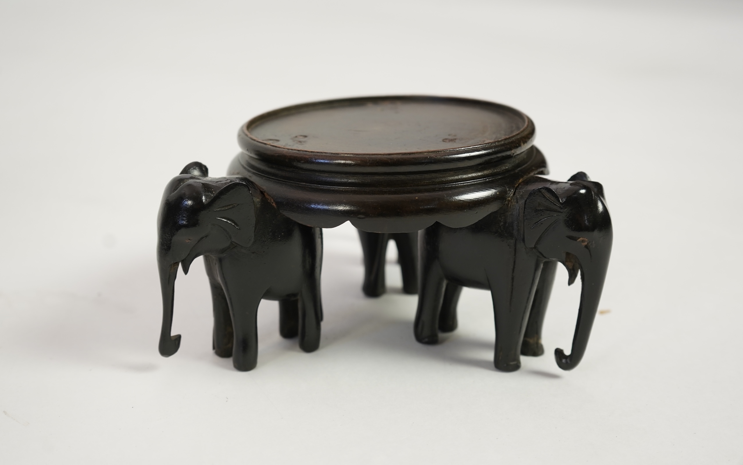 A group of sixteen Chinese hardwood stands together with a Japanese stand, 19th/20th century